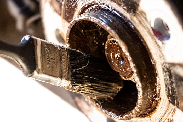 applying-fluid-film-to-car-wheel-hub.jpg