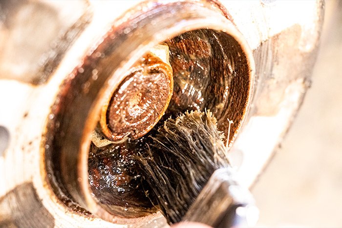 brushing-fluid-film-undercoating-on-car-wheel-hub.jpg